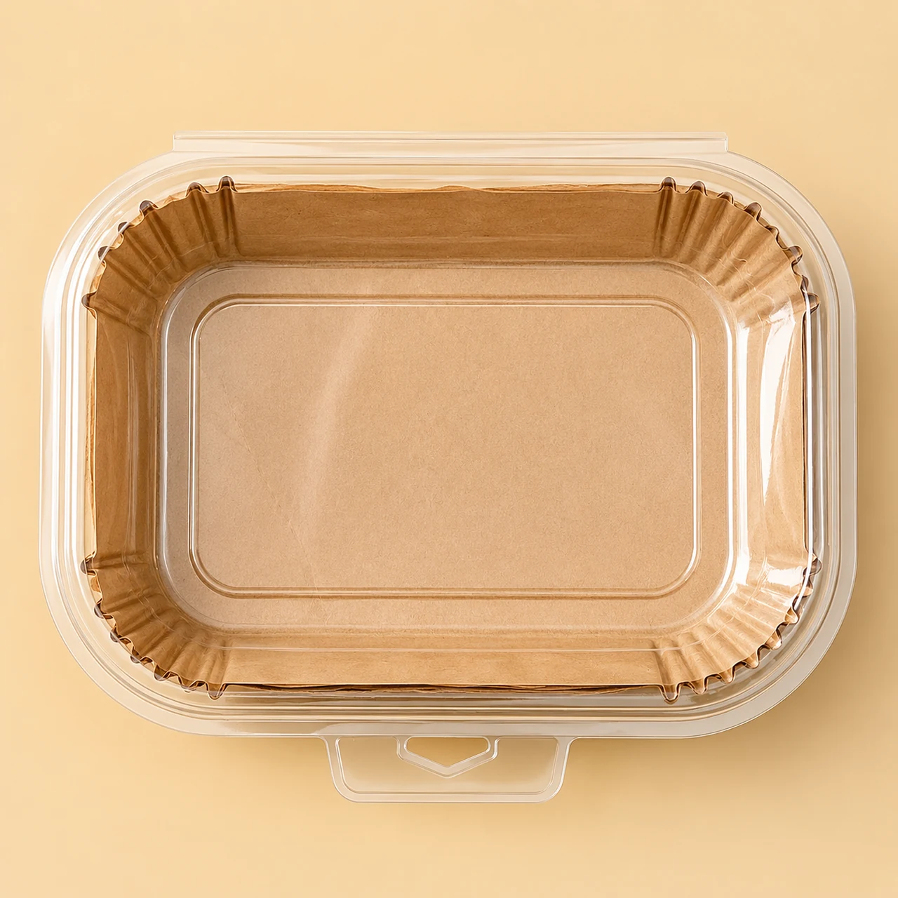 Natural-color rectangular air fryer paper liners inside a clear clamshell pack.